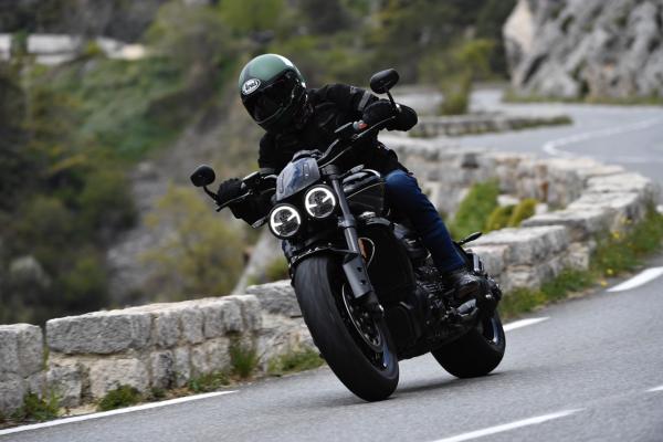 a motorcycle being ridden along a road