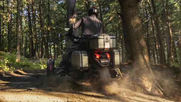 The Can-Am Canyon wheel-spinning on dirt