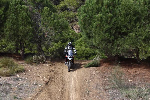 A motorcycle being ridden down a steep hill