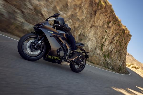 A sport bike being ridden along a canyon road