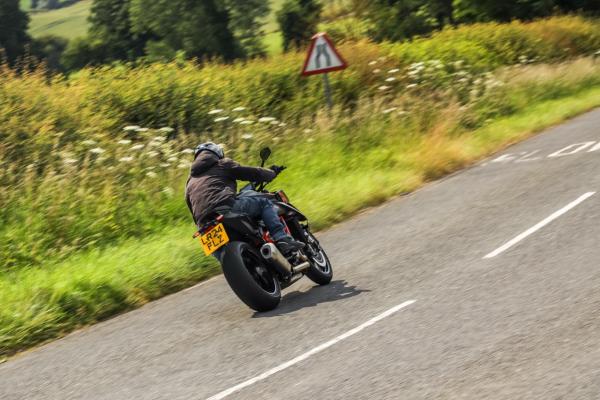 A KTM motorcycle exiting a corner