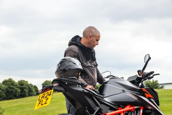 Toad Hancocks viewing the cockpit of the 1390 Super Duke R Evo