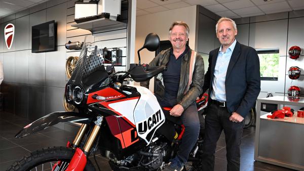 Charley Boorman sitting on a Ducati DesertX