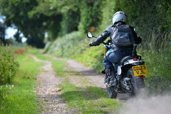 A motorcycle braking hard into a corner