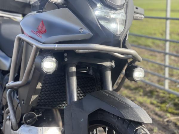 Fog lights and crash bars on an adventure motorcycle