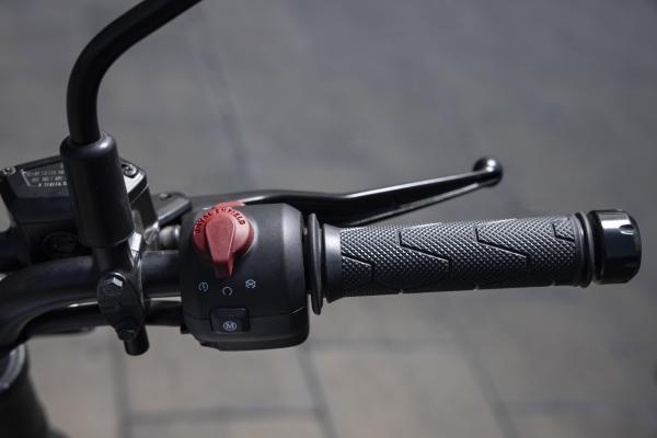 The switchgear and brake lever on a motorcycle