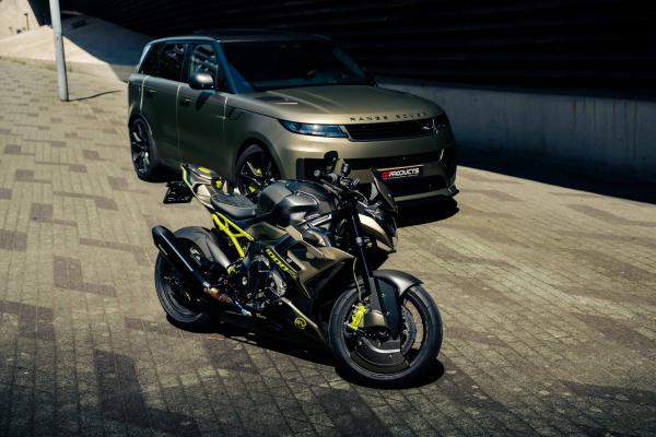 A custom BMW motorcycle and a Range Rover Sport SV