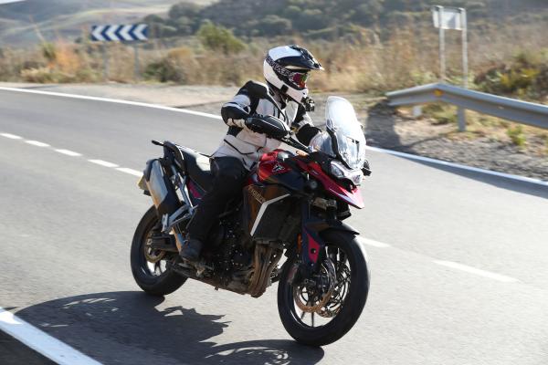 A motorcycle being ridden along a mountain road